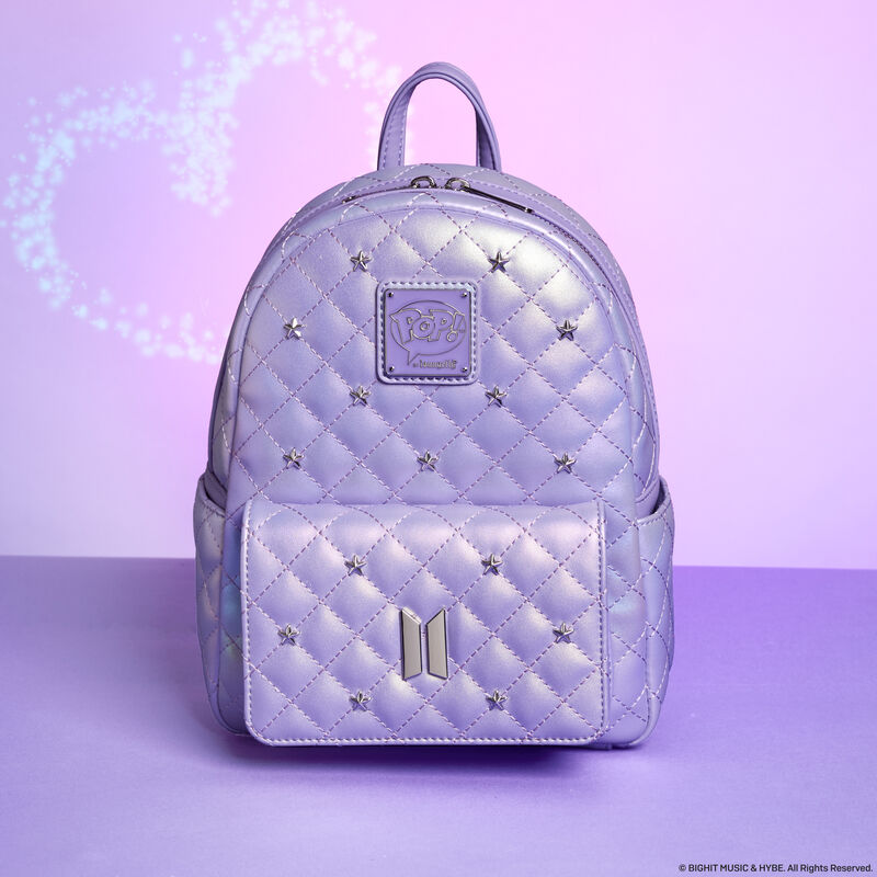 Iridescent Purple Loungefly BTS mini backpack, featuring an all-over quilted texture with silver stars. The bag sits against a purple background with a heart above it. 